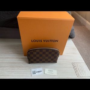 Louis Vuitton makeup pouch.